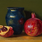 251201-a-pomegranate-and-a-dark-blue-ceramic-pot-9x7